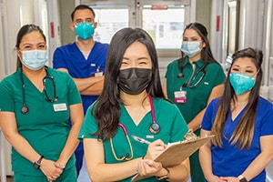 Pleasant Hill Post Acute nurses and caregivers in the hallway with masks on