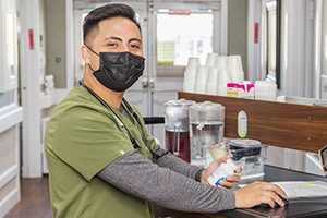 nurse at a nurse's cart at the Pleasant Hill Post Acute facility