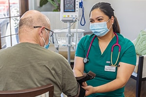 a nurse with a resident at the Pleasant Hill Post Acute facility