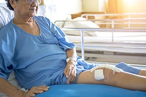 a resident in bed needing complex wound care